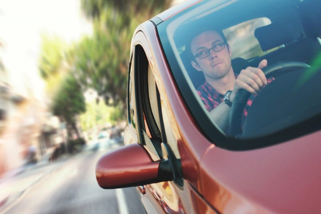 red-car-man-driving